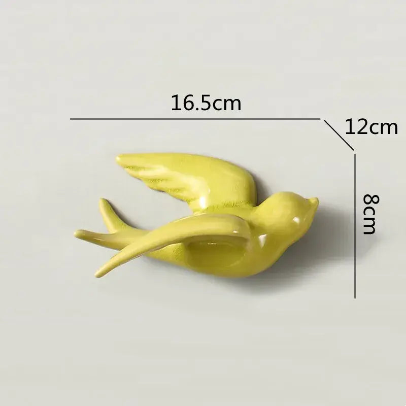Glossy yellow flying bird ceramic wall ornament with outstretched wings and sleek minimalist design for living room decor