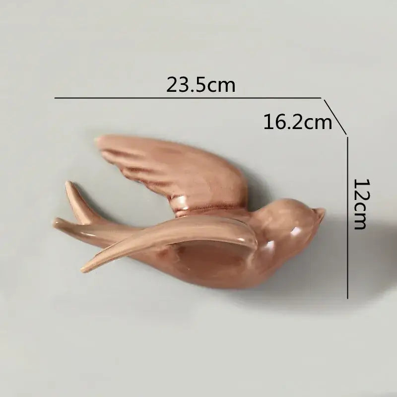 Glossy rose gold ceramic flying bird wall ornament with detailed wings and smooth sculpted body for living room decor
