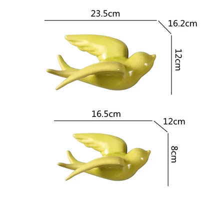 Yellow flying bird ceramic wall ornament with smooth glossy finish and detailed wing and tail design for living room decor
