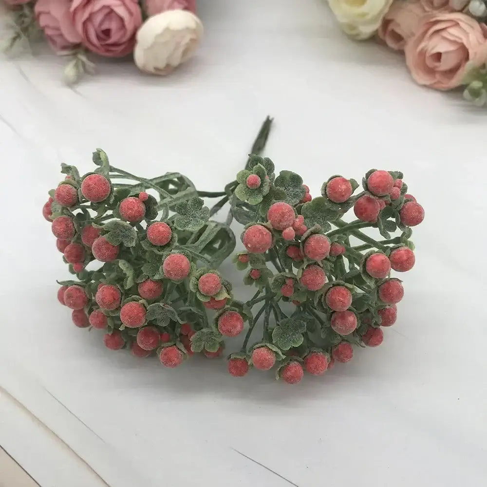 A cluster of pastel foam ball artificial berries with frosty pink fruits and green leaves for living room decorbites foam ball decor