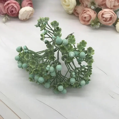 A delicate cluster of foam ball artificial flower with frosted leaves and mint berries for living room decorbites decor