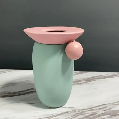 Pastel green geometric ball ceramic vase with pink circular lid and accent for decorbites geometric ball living room decor
