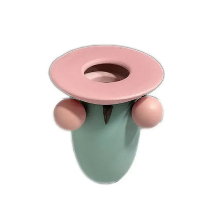 Pastel geometric ball ceramic vase with pastel pink and mint green rounded body and matching lid for living room decor