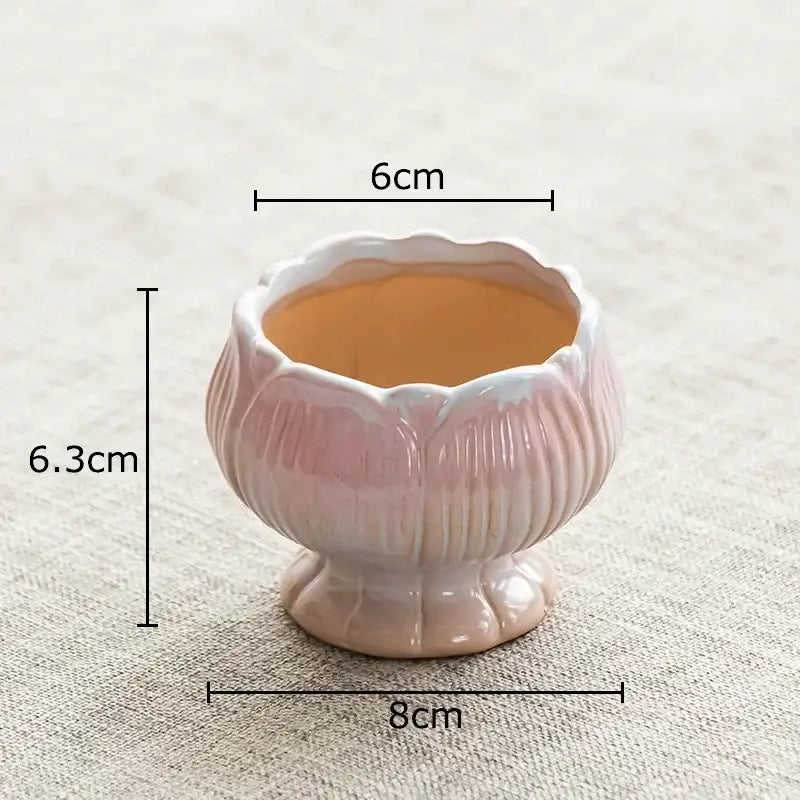 A delicate pink lotus flower ceramic planter with glossy finish and ridged details for decorbites lotus flower decor