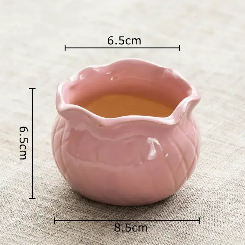 A delicate pink lotus flower ceramic tea pitcher with scalloped rim and leaf embossing for decorbites lotus flower decor