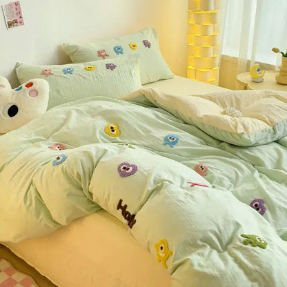 Pastel green quilted bedding set with colorful decorbites cartoon embroidery featuring monsters and hearts designs