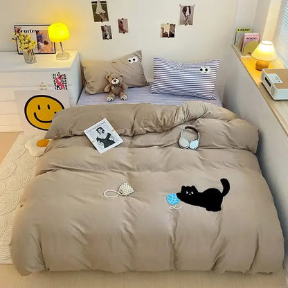 Beige quilted duvet cover with black cat and blue ball design in pastel green cartoon towel embroidery bedding set decorbites decor