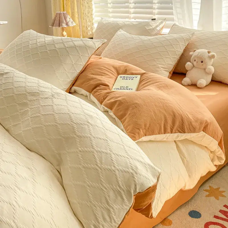 Cream-colored quilted duvet cover with plush orange lining from decorbites fresh bubble yarn bedding set