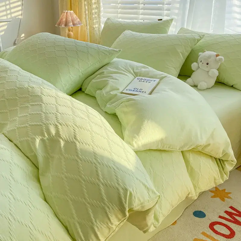 Pastel green fresh bubble yarn bedding set featuring a light green quilted duvet cover with a subtle diamond pattern