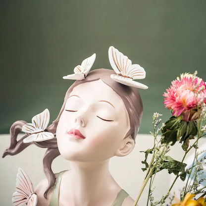 Pastel green and peach matte resin butterfly girl vase statue with sleeping girl and delicate white butterflies for decor