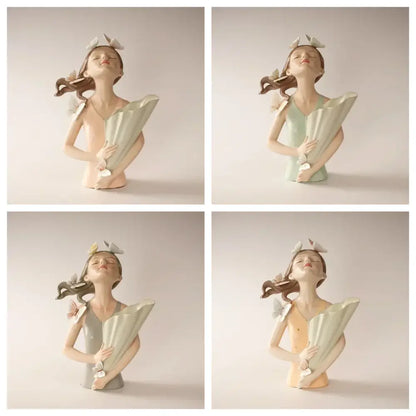 Porcelain butterfly girl vase statue in pastel green and peach featuring a pink butterfly girl holding an open fan