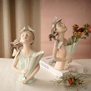 Pastel green and peach resin butterfly girl vase statue with pink butterfly accents for living room decor