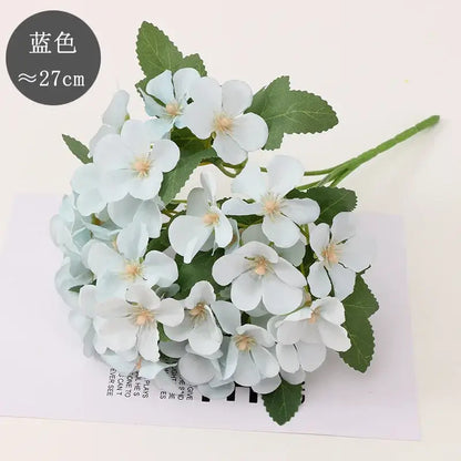 Pastel hydrangea begonia flower dry arrangement with light blue artificial flowers and green leaves for living room decor dry flower embossing
