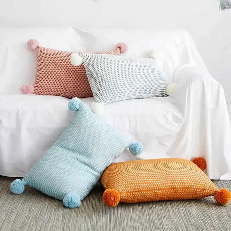 Pastel-colored knit pompom ball cushion cover with fluffy tassels for bedroom decor by decorbites knit pompom