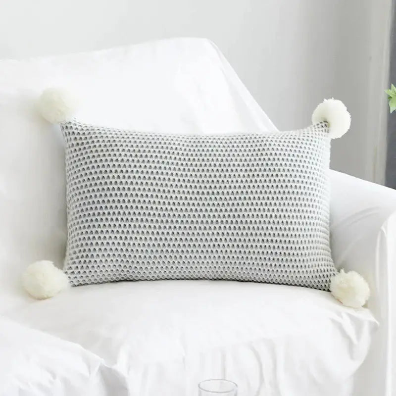 Gray knitted rectangular cushion cover with white knit pompom ball accents for pastel decorbites bedroom decor