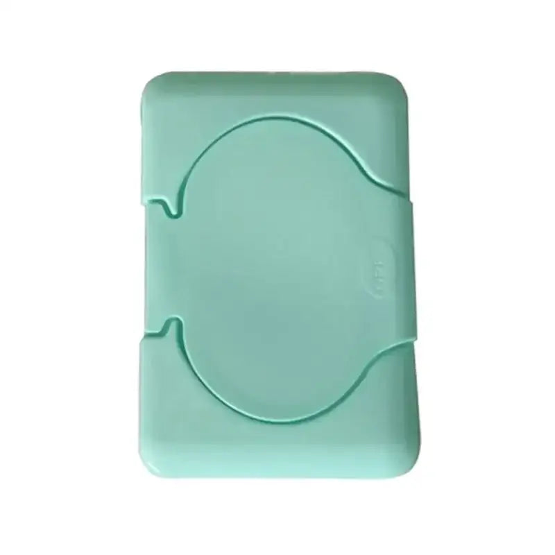 A pastel mint green plastic baby wet wipes dispenser with a rounded shape and circular cutout for easy access