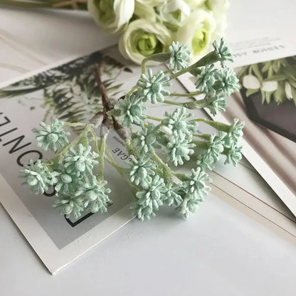 Pastel multi color decorative vase set with delicate mint-green artificial floral decor featuring frost-like petals