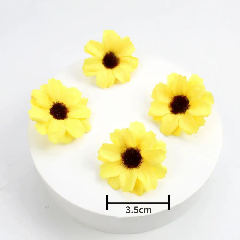 Bright yellow artificial sunflowers with dark centers on white base complement decorbites mini daisy artificial flowers wedding decor