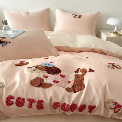 Pastel pink cotton bedding set with decorbites cartoon embroidery featuring a plush puppy in blue hat and red hearts
