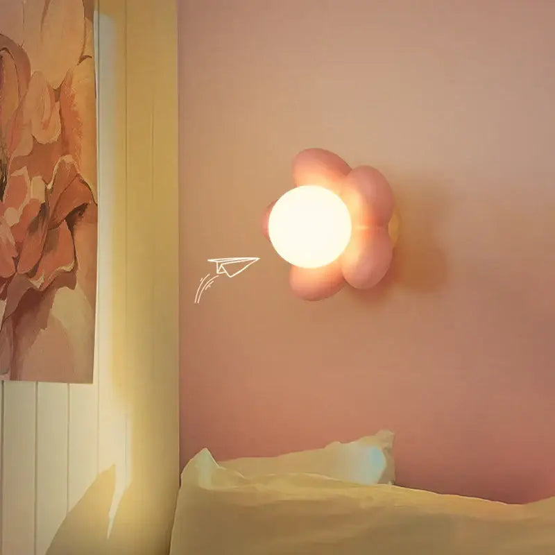 Pastel pink cream flower wall lamp with glowing circular light center for bedroom lighting decorbites cream flower wall lamp