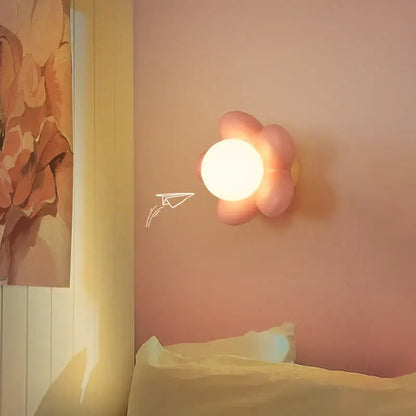 Pastel pink cream flower wall lamp with glowing circular light center for bedroom lighting decorbites cream flower wall lamp