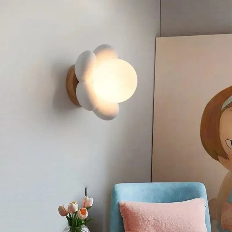 Pastel pink cream flower wall lamp with white cloud-shaped sconce and wooden base for bedroom decorbites cream flower lighting