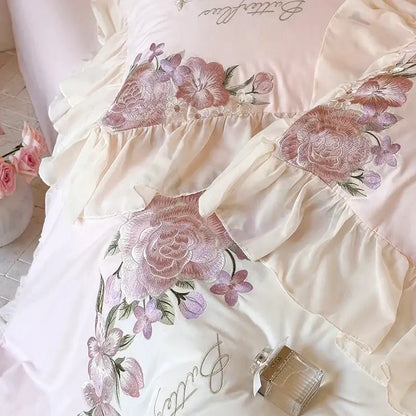 Ivory satin bedding set with pastel pink flowers lace ruffles and intricate floral embroidery for bedroom decor