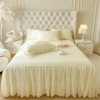 Cream-colored lace bed skirt with flowing ruffled hem and floral embroidery for pastel pink lace bed sheet set