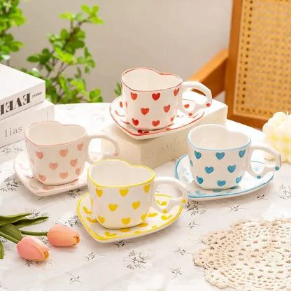 Set of four ceramic 250ml coffee cups with matching saucers featuring pastel polka dot patterns and coordinating rims