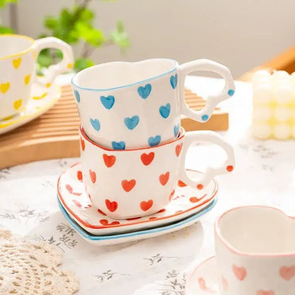 Stacked ceramic 250ml coffee cup and saucer set with blue and red heart patterns for dining room use