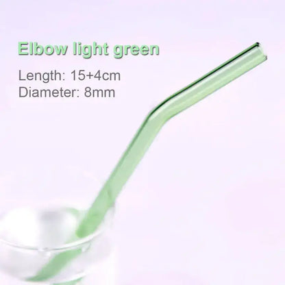 A translucent light green curved elbow glass straw from the pastel ridged decorbites glass straws set for eco friendly use