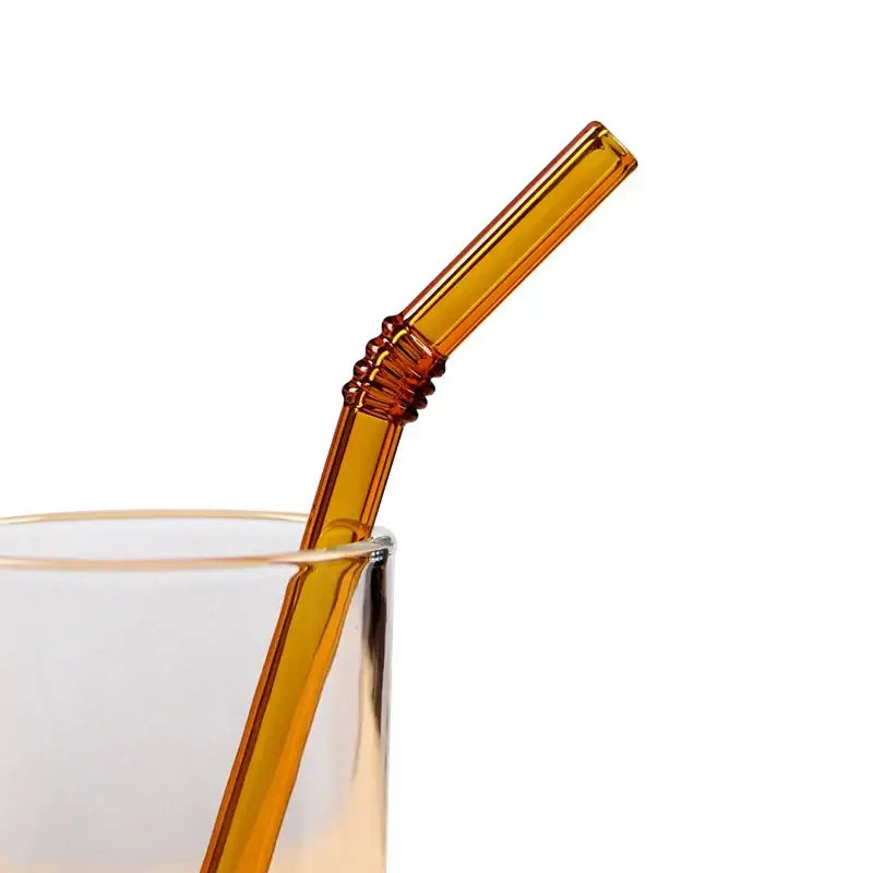 Amber-colored glass straw with twisted textured grip from decorbites glass straws set for eco friendly kitchen use