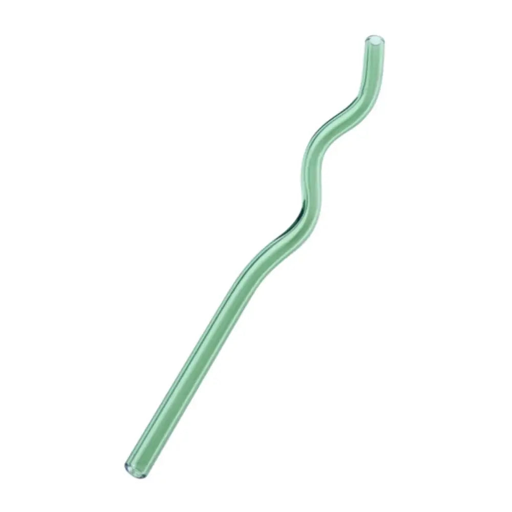 A translucent mint-green decorbites glass straw with a smooth wavy design from a pastel ridged glass straws set