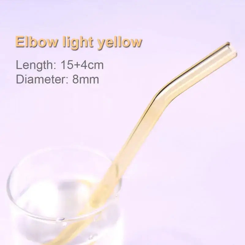 A translucent light yellow curved elbow glass straw from the pastel ridged glass straws set by decorbites for eco friendly use