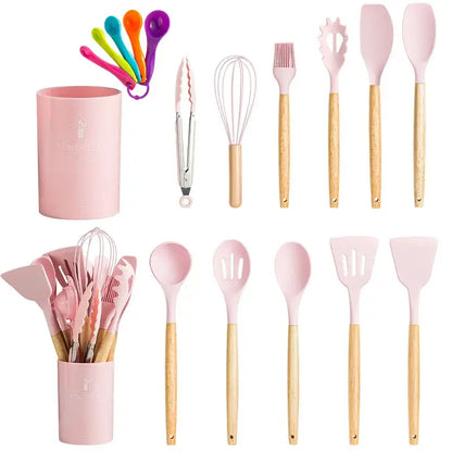 Pink silicone kitchen utensils set with wooden handles and matching ceramic storage cup for kitchen use