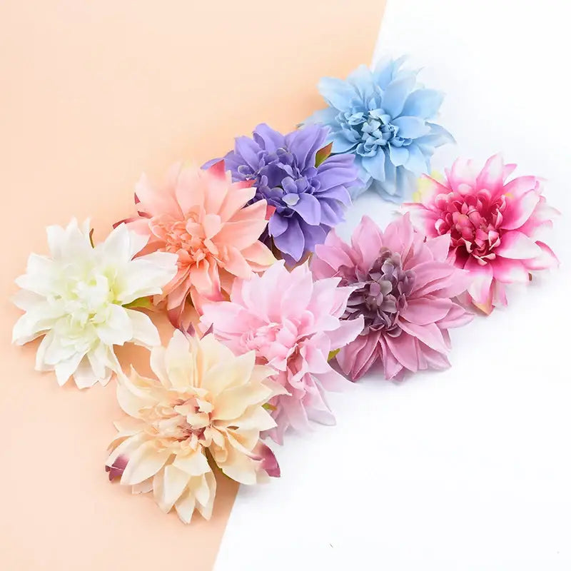 A collection of pastel silk gerbera decorative flowers in white peach pink lavender and light blue for wedding decor