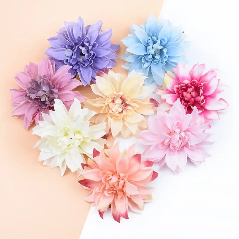 A collection of pastel silk gerbera decorative flowers in lavender pink peach cream and white for wedding decor