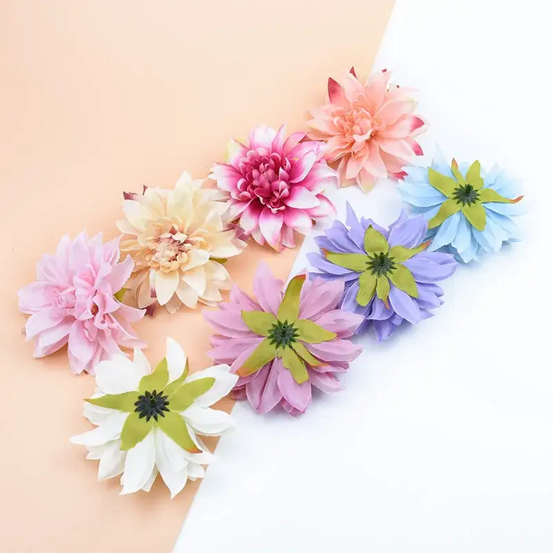 A collection of pastel silk gerbera decorative flowers with layered petals and green centers for wedding home décor