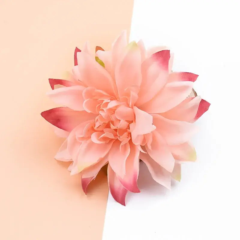 A delicate peach-colored silk gerbera decorative flower with soft layered petals and subtle pink tips for home decor