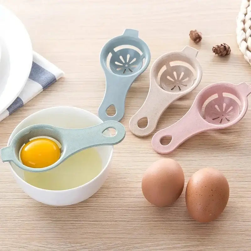 Pastel-colored plastic egg white separator with handle and slotted bowl design for easy egg white separation
