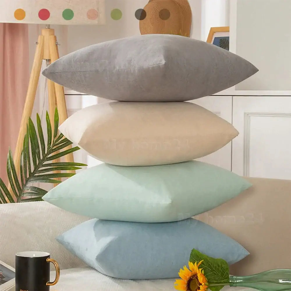 Stack of four pastel velvet rectangular pillow covers in gray beige mint green and light blue pillow cover set for living room decor