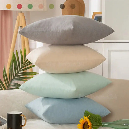 Stack of four pastel velvet rectangular pillow covers in gray beige mint green and light blue pillow cover set for living room decor