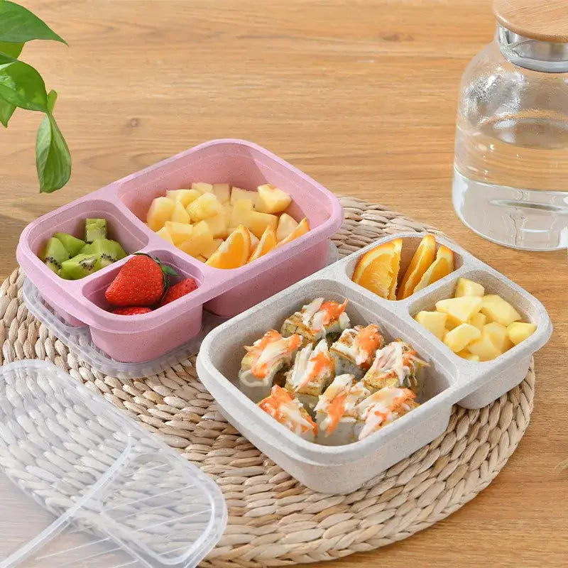 Pastel pink and gray wheat straw bento box set with three compartments and clear plastic lids for lunch storage