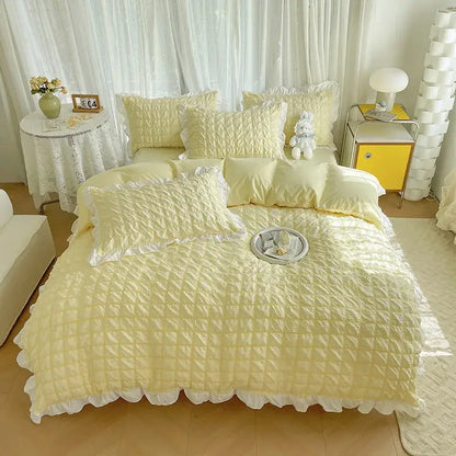 Soft pale yellow quilted bedding set with delicate white ruffled trim made from decorbites bubble cotton lace