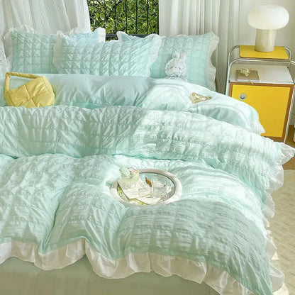 Pastel yellow bubble cotton lace bedding set with mint green quilted design white ruffled edges and matching pillows