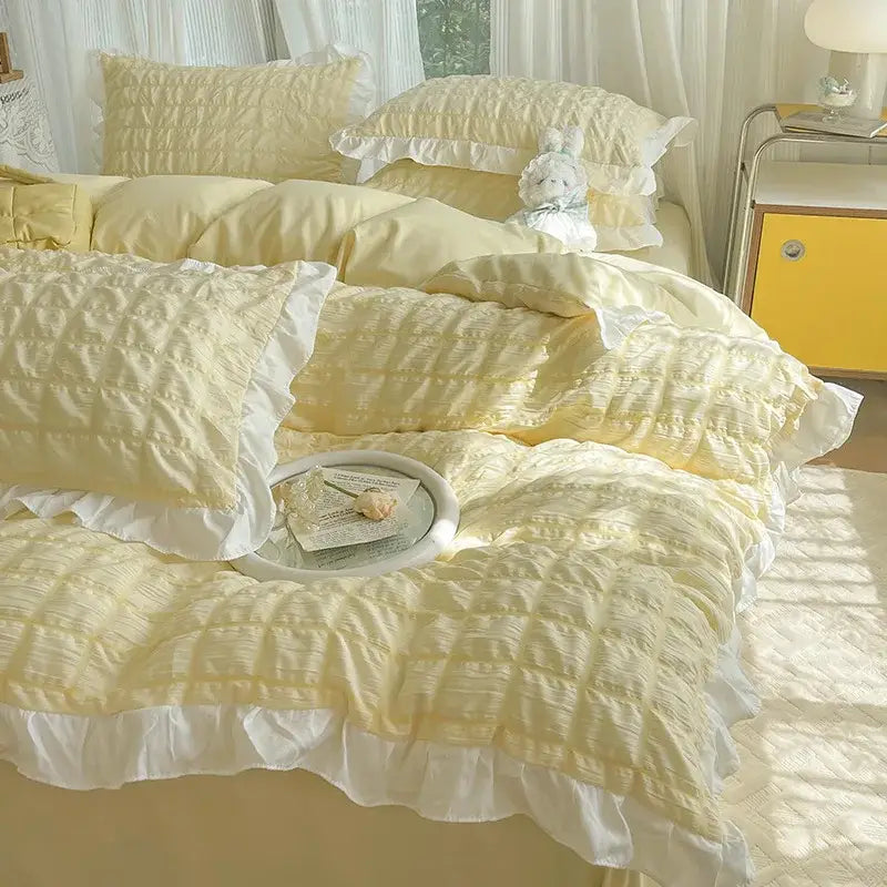 Soft yellow quilted bedding set with delicate white ruffles made from decorbites bubble cotton lace for elegant bedroom decor