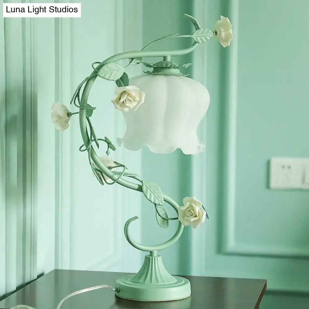 A delicate mint green metal table lamp with white rose accents and usb charger for bedroom led incandescent use
