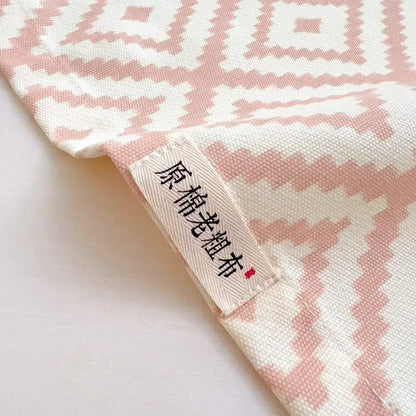Soft pink and white geometric-patterned cotton bed sheet set with woven texture for bedroom use