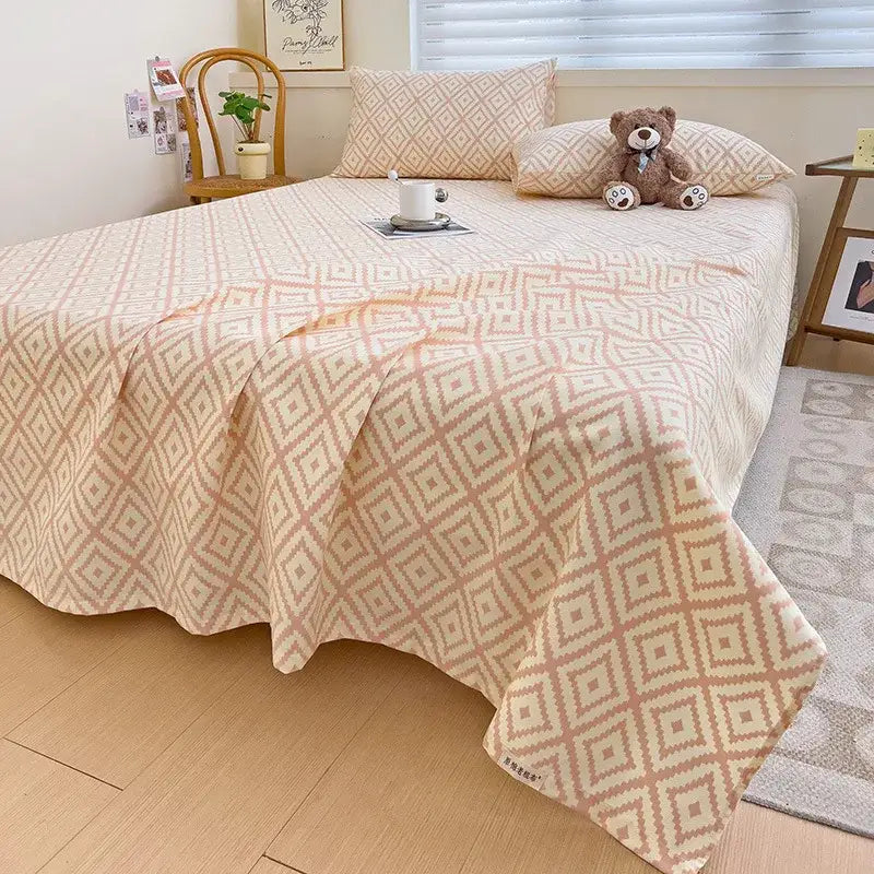Peach and cream geometric bed sheet set featuring a cozy textured weave bedspread for comfortable bedroom use