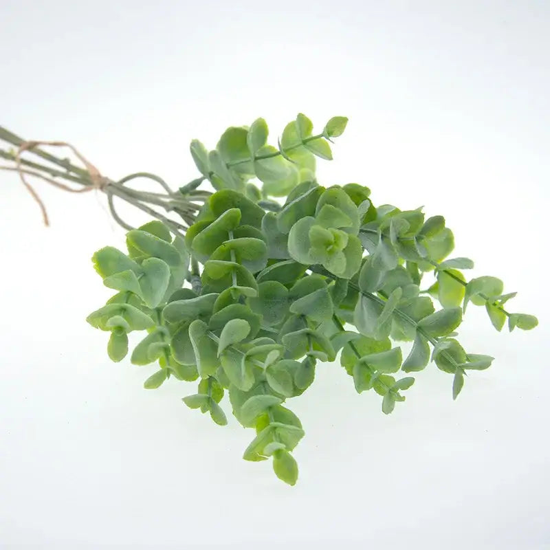 A bundle of peach and green eucalyptus leaves artificial arrangement with soft muted green decorbites eucalyptus leaves